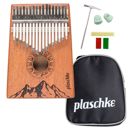 Vorderansicht der Alps-Gold Kalimba aus Mahagoni mit Laser-Gravur der Südtiroler Alpen vor weißem Hintergrund