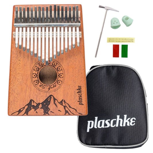 Vorderansicht der Alps-Gold Kalimba aus Mahagoni mit Laser-Gravur der Südtiroler Alpen vor weißem Hintergrund