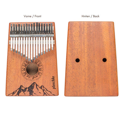 Gegenüberstellung der Vorderseite mit Berg-Gravur und der glatten Rückseite des Daumenklaviers zur Ansicht der Holzmaserung